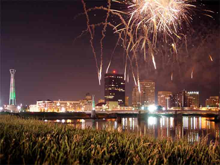 city landscape with fireworks in the background